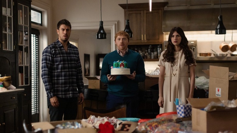 Toby Kebbell, Rupert Grint, and Nell Tiger Free looking shocked in "Servant"