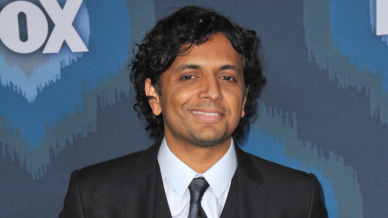 M. Night Shyamalan premire smiling red carpet