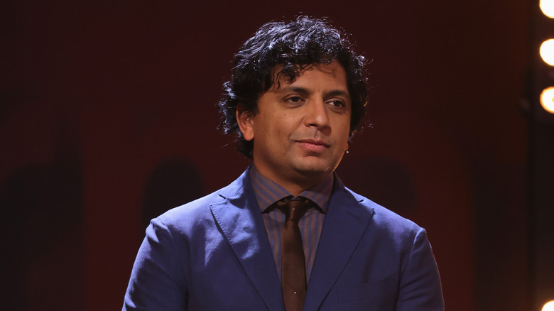 M. Night Shyamalan looking offstage