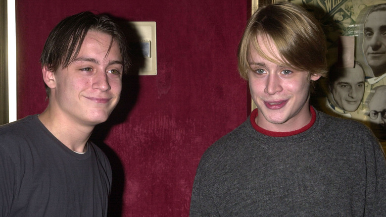 Macaulay and Kieran Culkin smiling