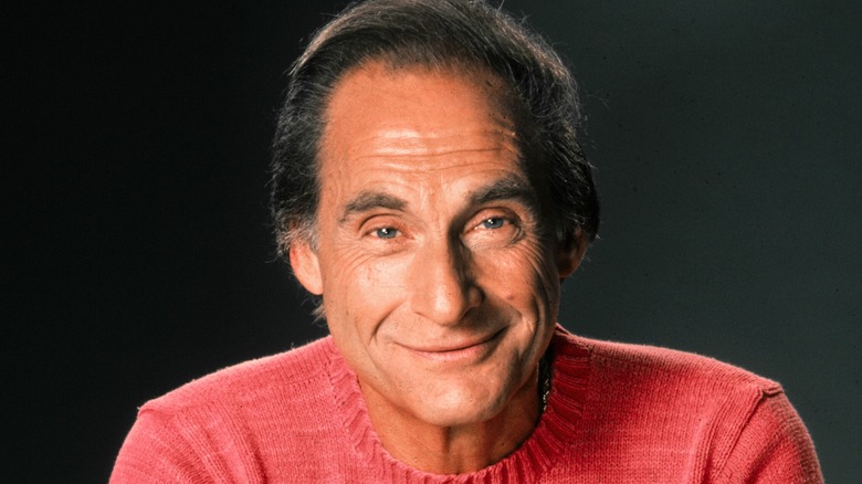 Sid Caesar smiling, red sweater