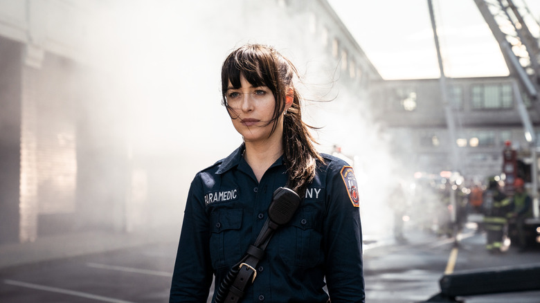 Cassie standing in paramedic uniform