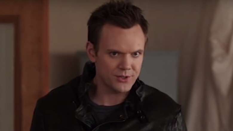 Joel McHale in leather jacket Community