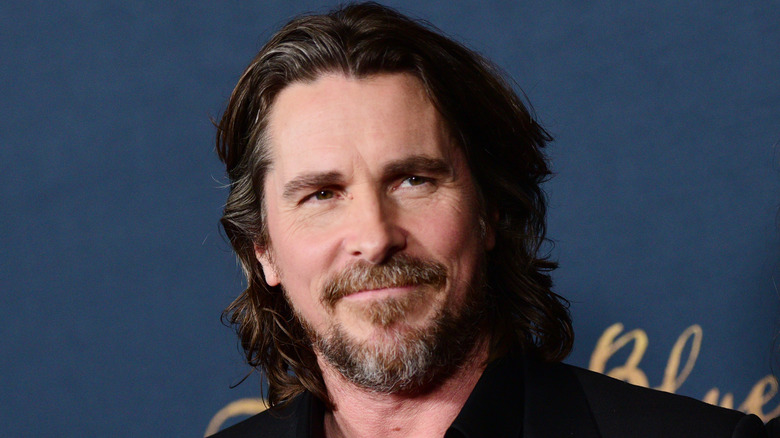 Christian Bale looking to the right