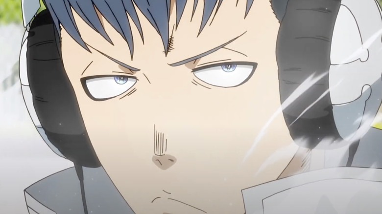 Karim from Fire Force wearing headphones