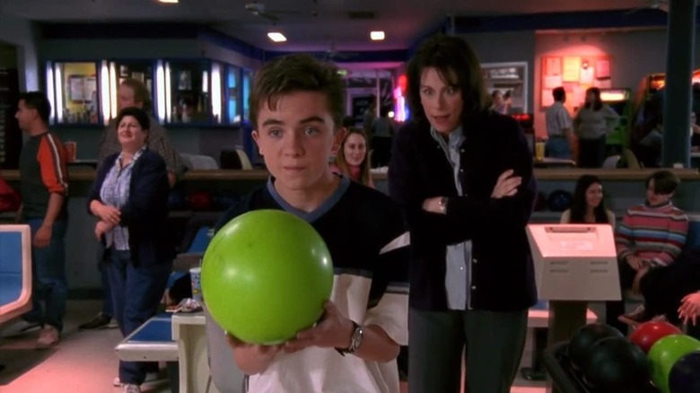 Malcolm holding a bowling ball