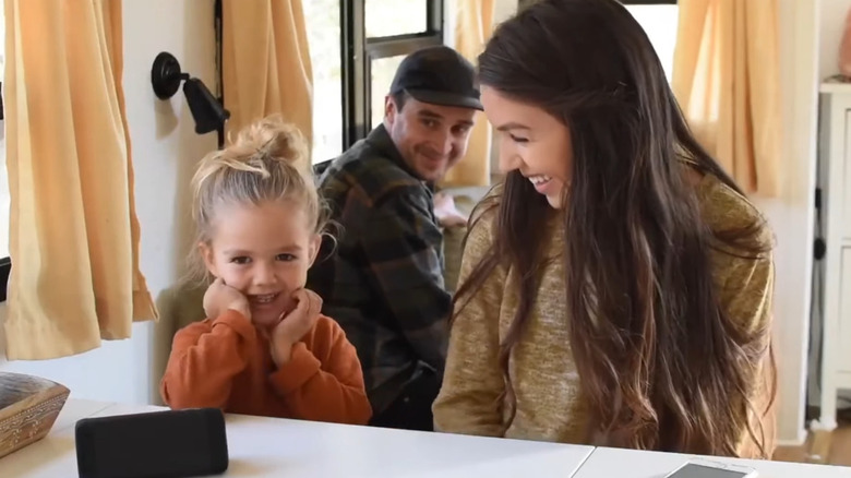 Parents and child smiling