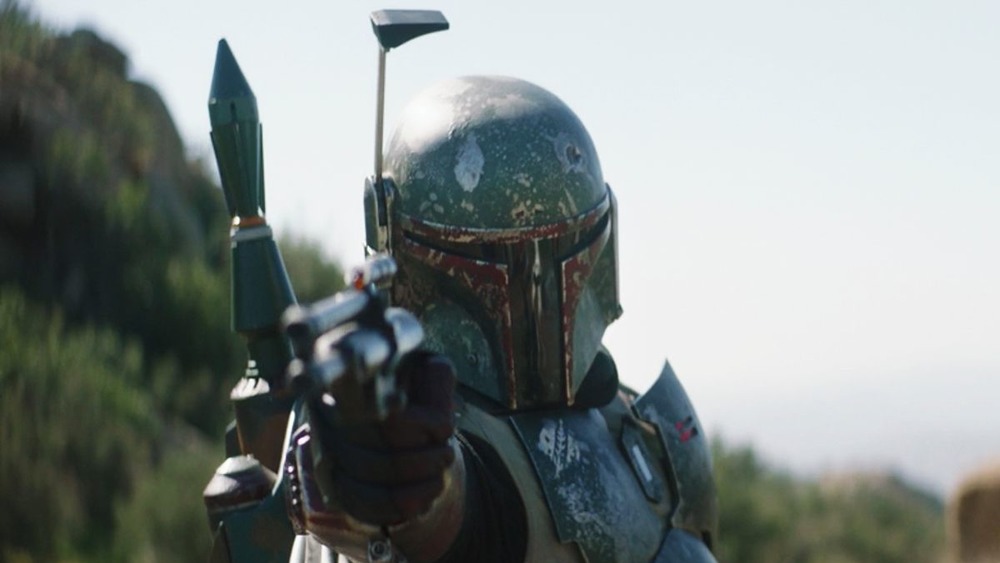 Boba Fett pointing a blaster