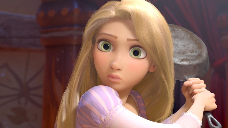 Rapunzel holding frying pan