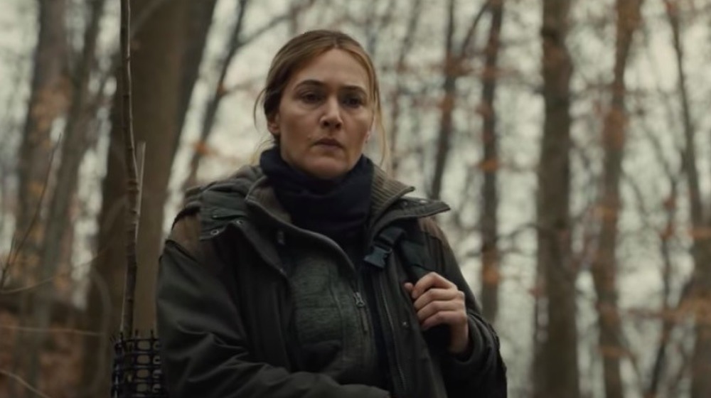 Winslet in the woods in Mare of Easttown