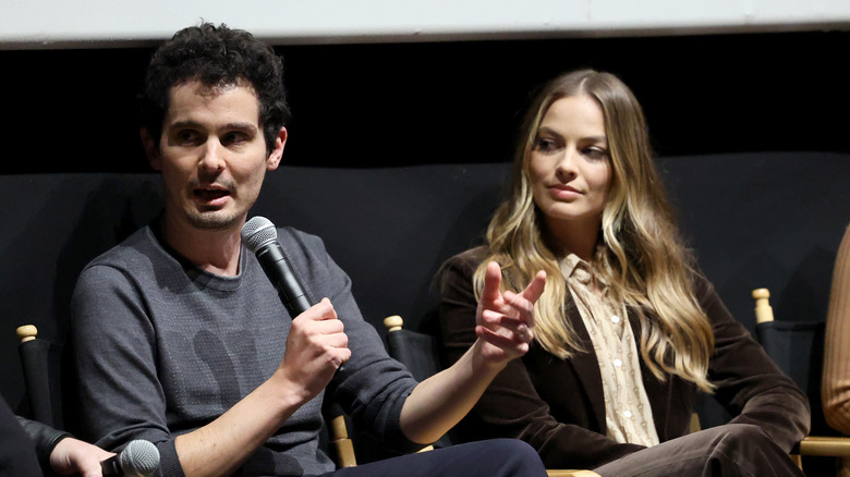 Damien Chazelle and Margot Robbie at event