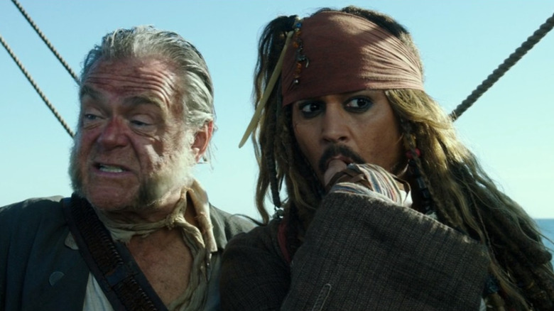 Jack Sparrow and Gibbs standing together on the ship