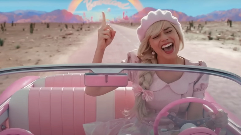 Barbie rocks out in car