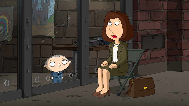 Lois Griffin sitting in a chair looking at Stewie Griffin