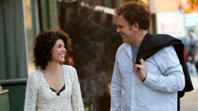 Marisa Tomei and John C. Reilly smiling in Cyrus