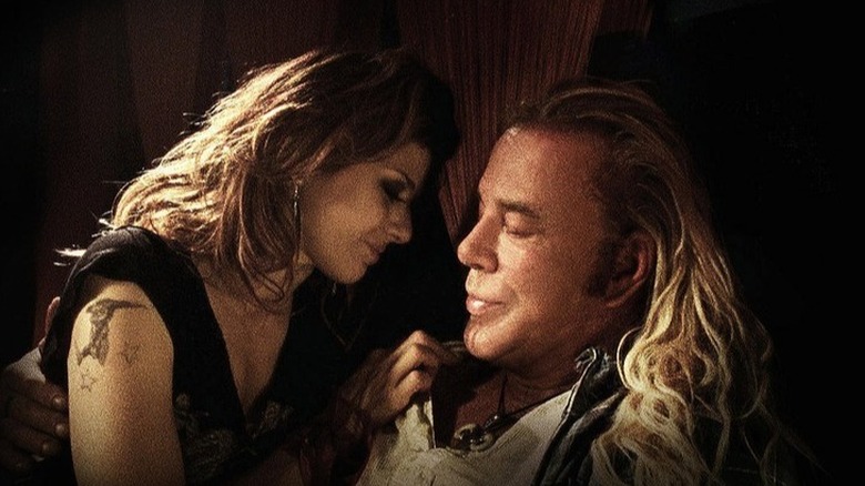 Marisa Tomei and Mickey Rourke cuddling in The Wrestler