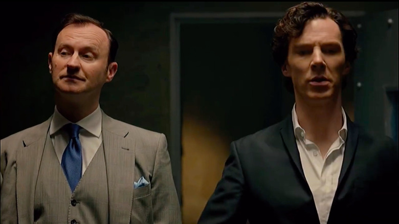 Mycroft and Sherlock Holmes standing next to each other in Sherlock