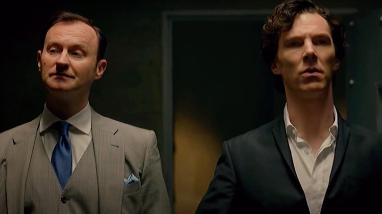 Mycroft and Sherlock Holmes standing next to each other in Sherlock