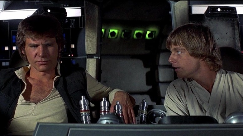 Han and Luke sitting in cockpit