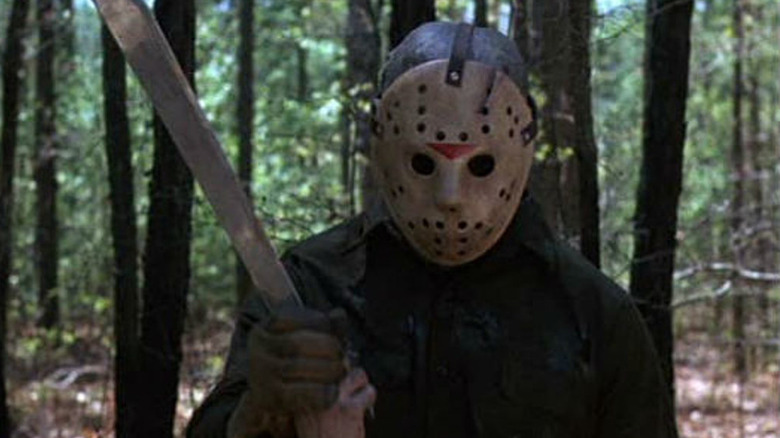 Jason swings a machete in the woods