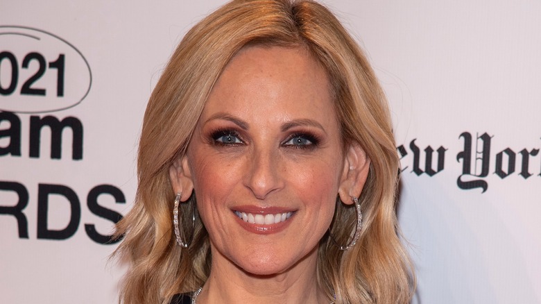 Marlee Matlin blonde hair hoop earrings