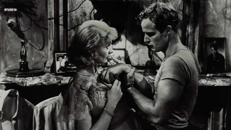 Marlon Brando wrestles with a woman