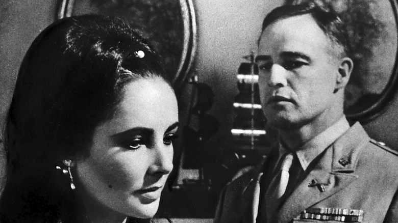 Marlon Brando stares at Elizabeth Taylor