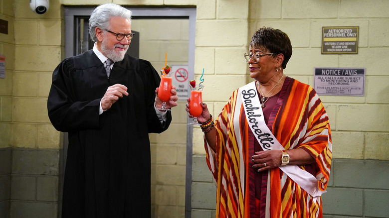 John Larroquette and Marsha Warfield toasting drinks