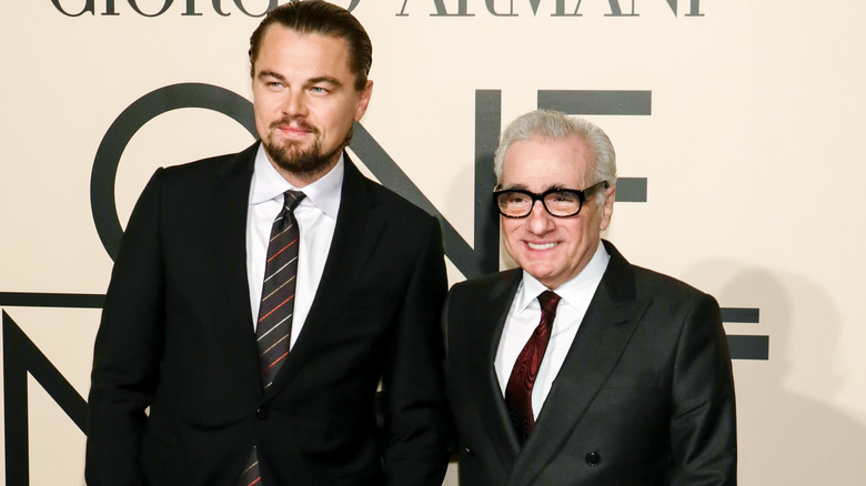 Martin Scorsese and Leonardo DiCaprio in suits at Armani event smiling