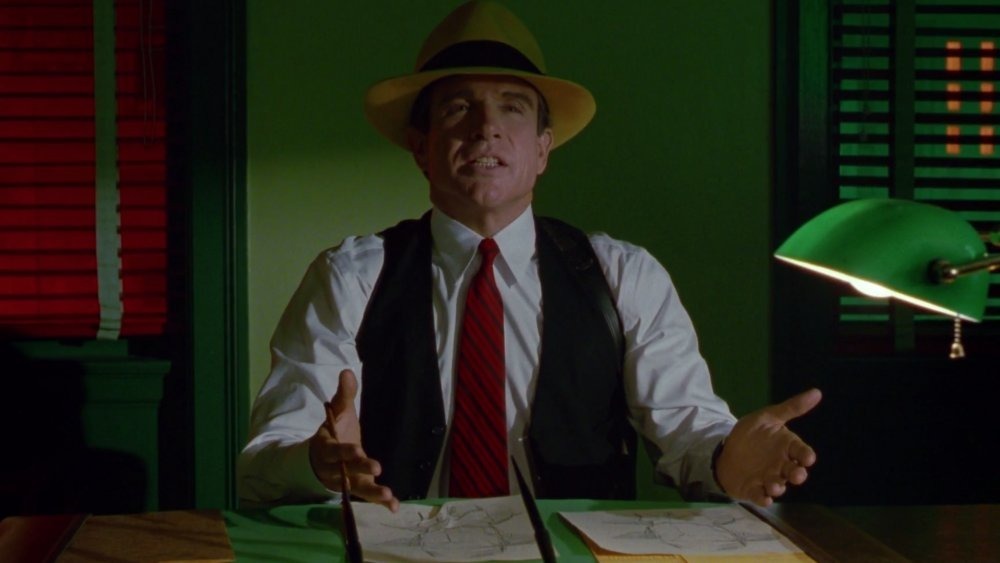 Dick Tracy sitting at desk