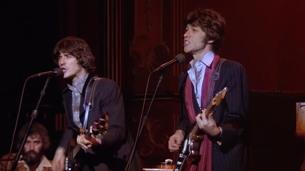 Robbie Robertson playing guitar