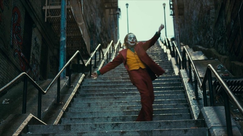 Joker dancing down stairs