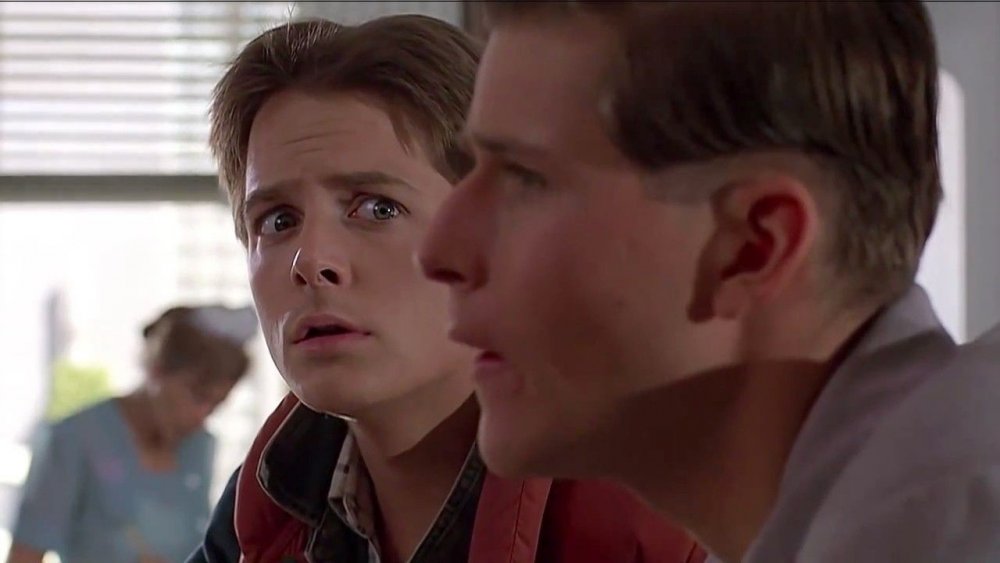 Michael J. Fox as Marty McFly and Crispin Glover as George McFly in Back to the Future