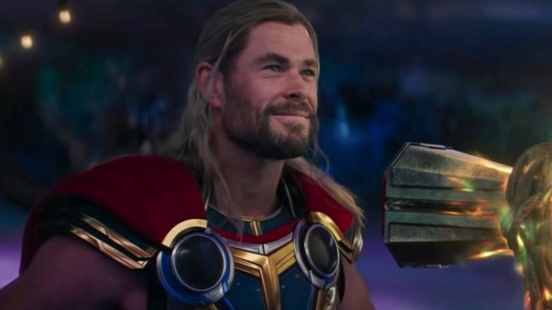 Thor smiling with Stormbreaker