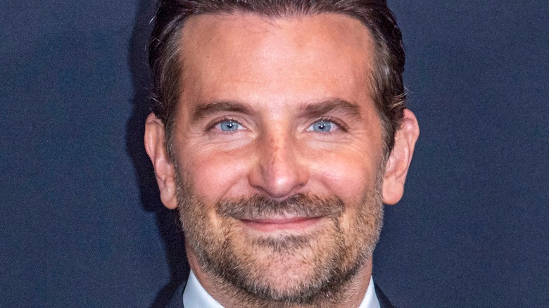 Bradley Cooper smiling into camera