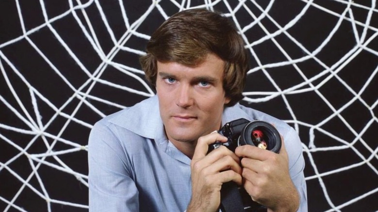 Peter Parker holds a camera