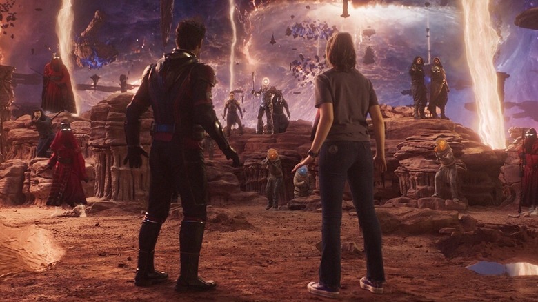 Scott and Cassie standing before aliens