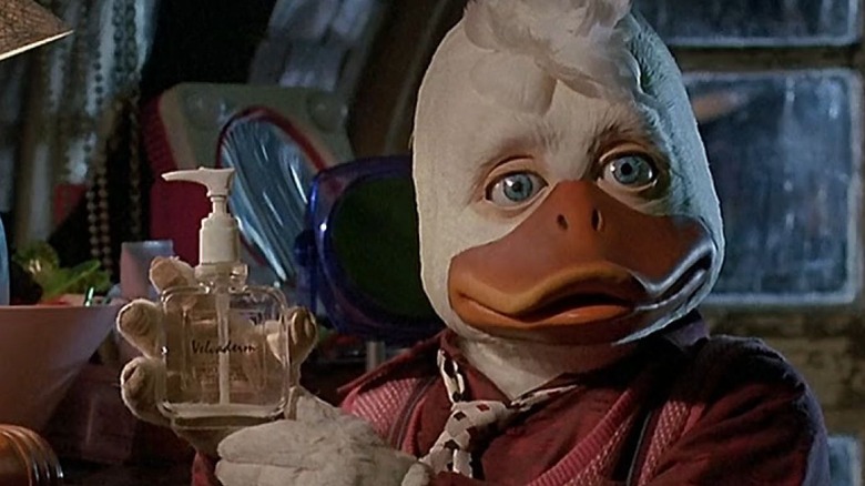 Howard holds a bottle in "Howard the Duck" (1986)