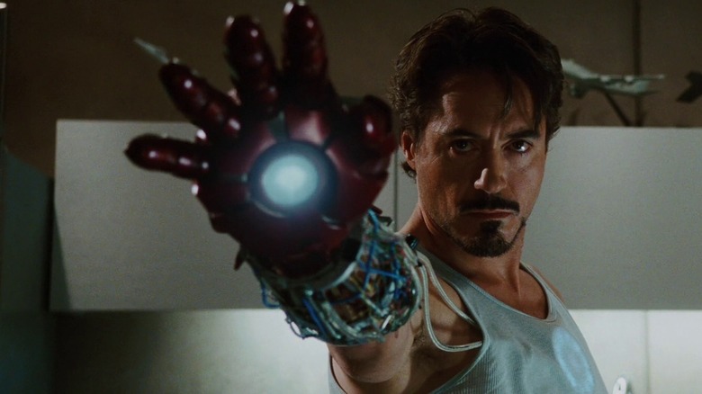 Tony Stark raises iron hand