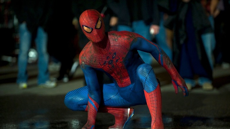 Spider-Man lands in the street in "The Amazing Spider-Man 2" (2014)