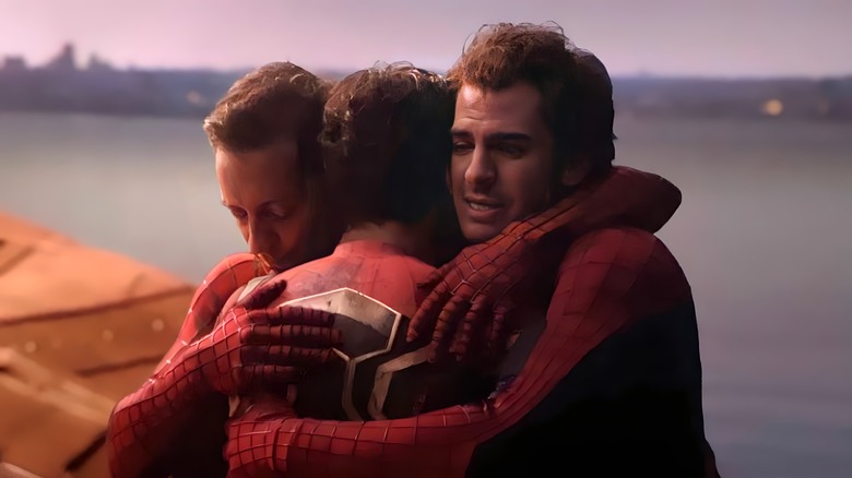 Three Spider-Men hugging 