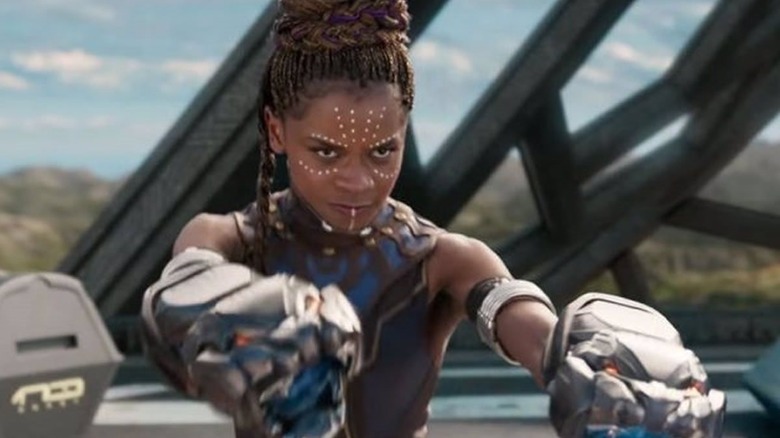 Shuri aims her gauntlet cannons