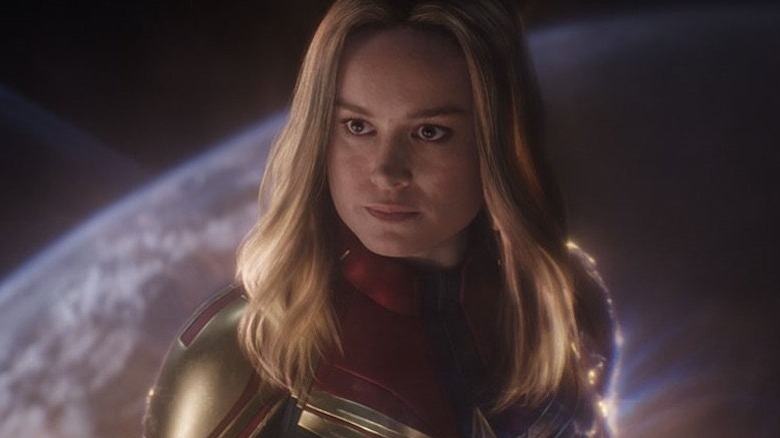 Captain Marvel hovers over a planet