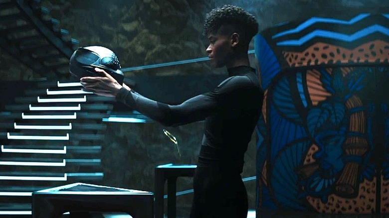 Shuri holds Black Panther helmet