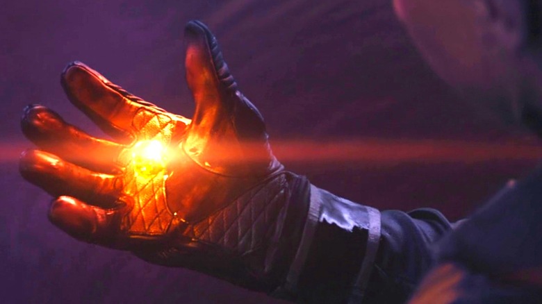 Hawkeye looking at the Soul Stone in his hand on Vormir in Avengers: Endgame (2019)