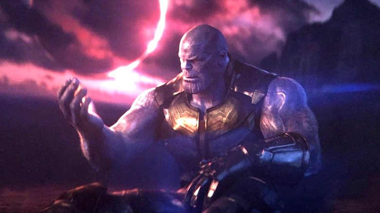 Thanos looking at the Soul Stone in his hand on Vormir in "Avengers: Infinity War" (2018)