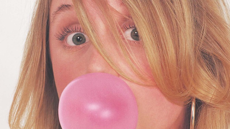 Girl blowing gum bubble