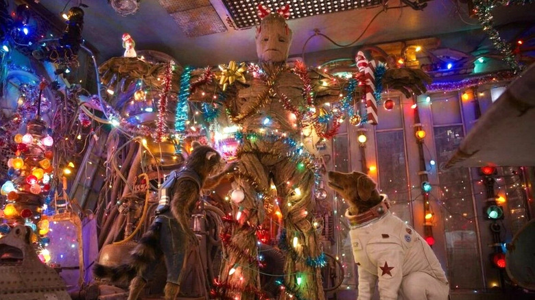 Cosmo and Rocket helping decorate Groot with Christmas lights