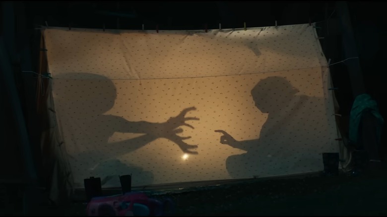 Kids making shadow puppets