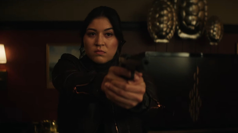 Maya Lopez holds gun